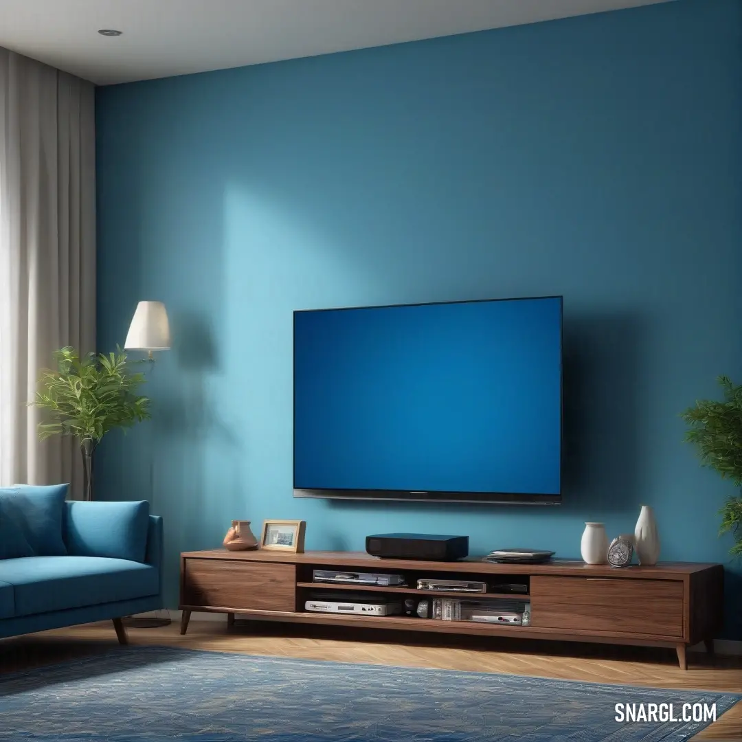 CG Blue color. Living room with a blue couch and a flat screen tv on a wall above a wooden entertainment center