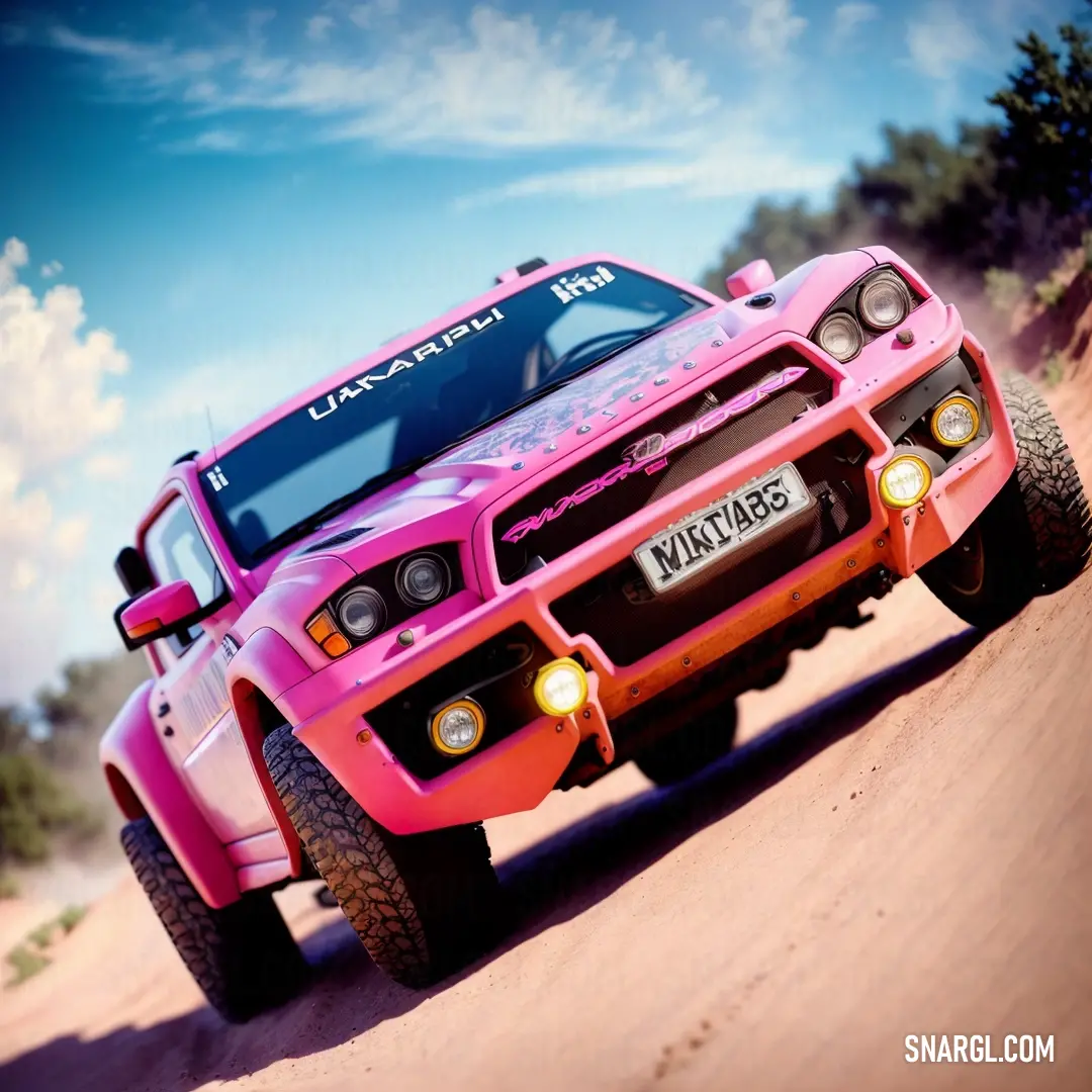 Pink truck driving down a dirt road next to trees and bushes on a sunny day with a blue sky