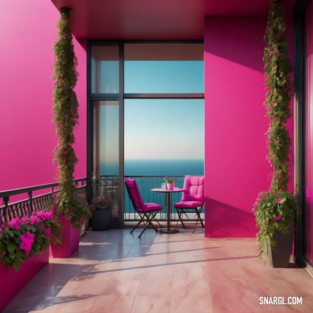 Balcony with a table and chairs and a pink wall and a balcony with a view of the ocean. Example of CMYK 0,78,55,13 color.