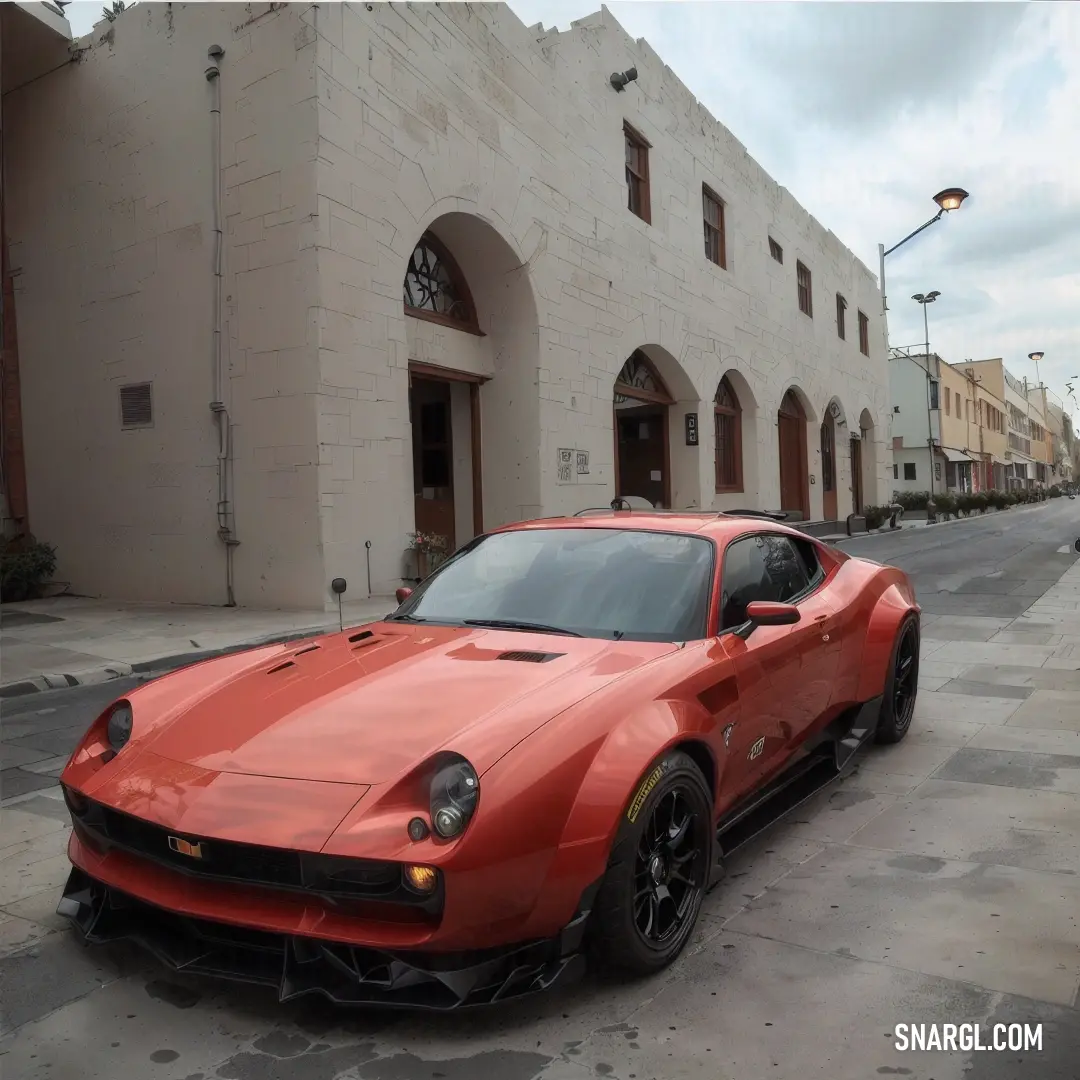 Red sports car parked on the side of the road in front of a building with arched windows and a door. Example of Chestnut color.