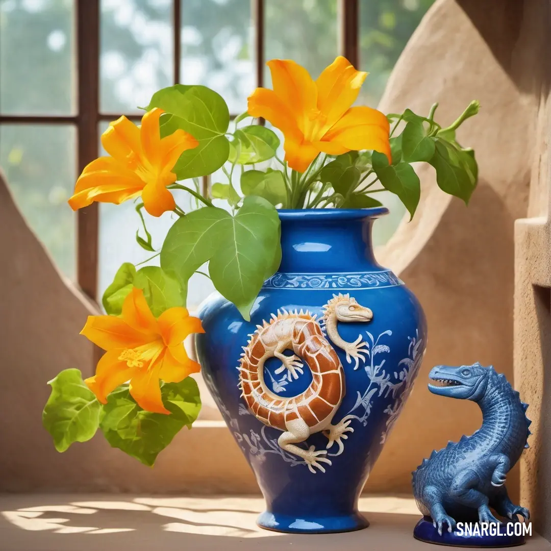 Blue vase with a dragon and flowers in it next to a blue toy lizard. Example of RGB 255,167,0 color.
