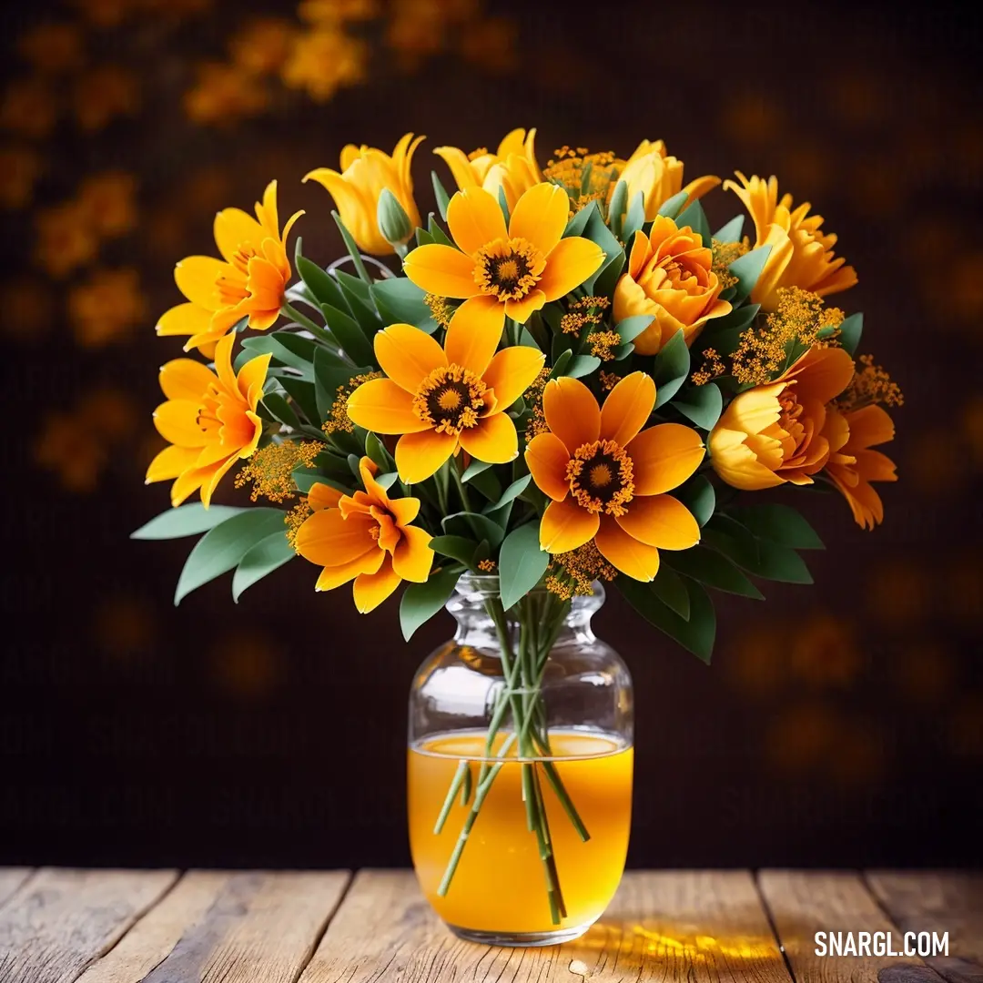 Vase filled with yellow flowers on top of a wooden table next to a glass of orange juice and a black background