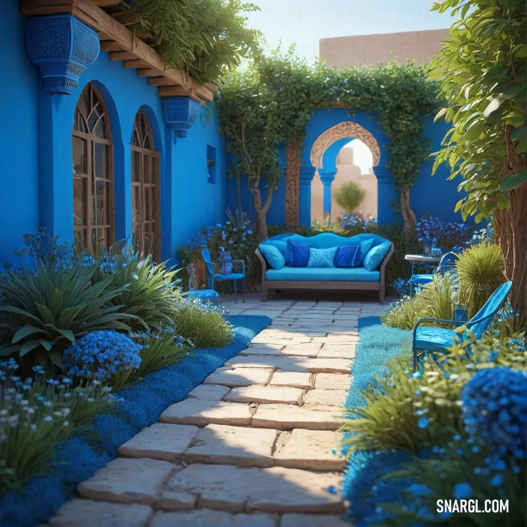 Blue couch in a garden next to a tree and a blue wall with a archway. Color #0047AB.