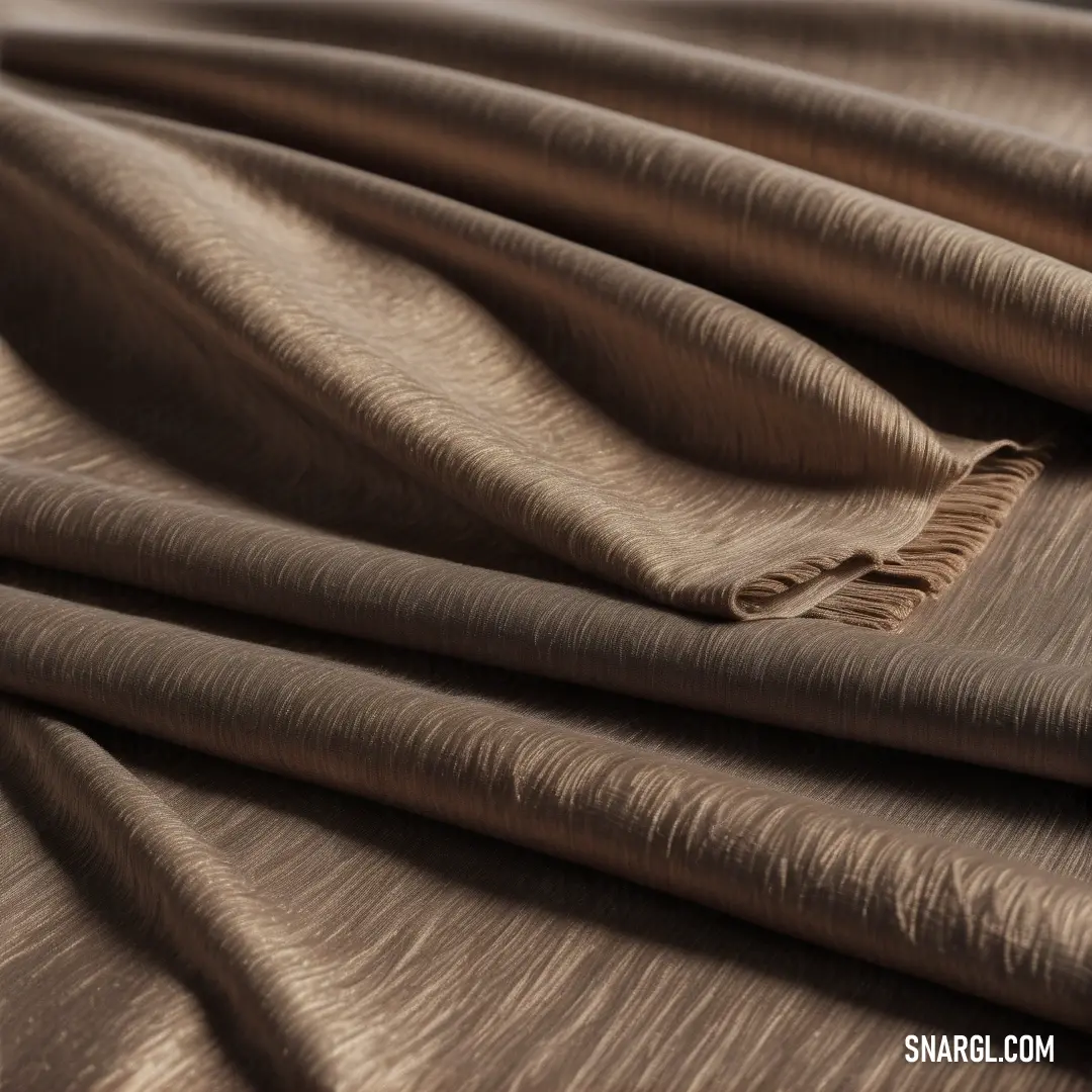 Close up of a brown fabric with a wavy pattern on it's surface. Color Coffee.