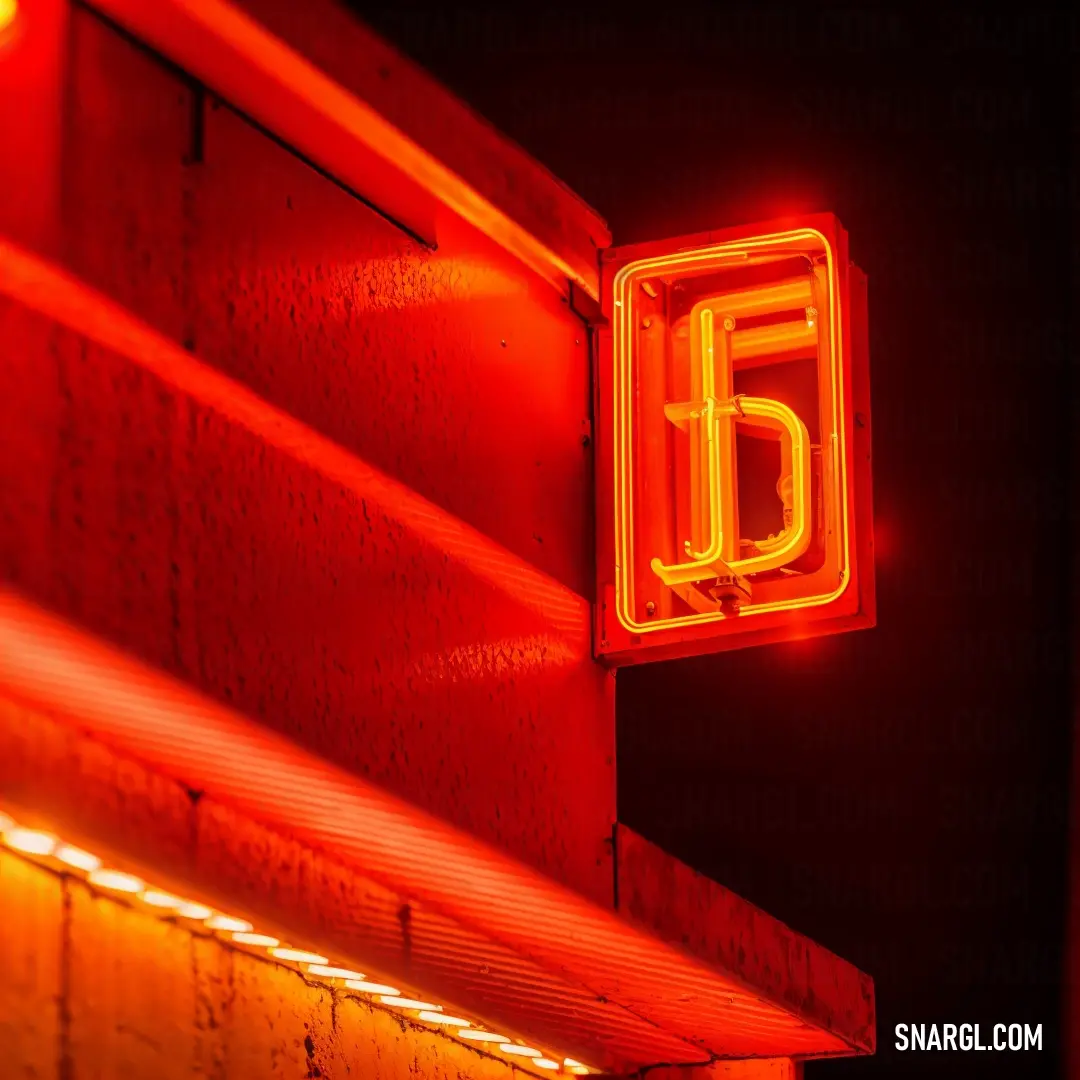Coquelicot color. Neon sign on a building that says 5 eleven on it's side and a red light on the side