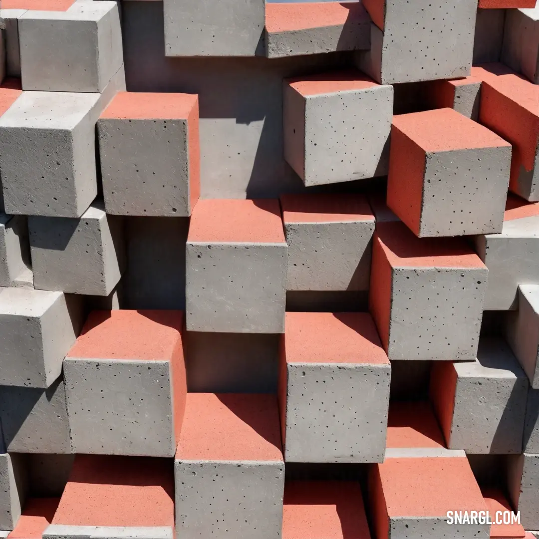Coral pink color example: Large pile of cement blocks stacked together in a pile with a sky background