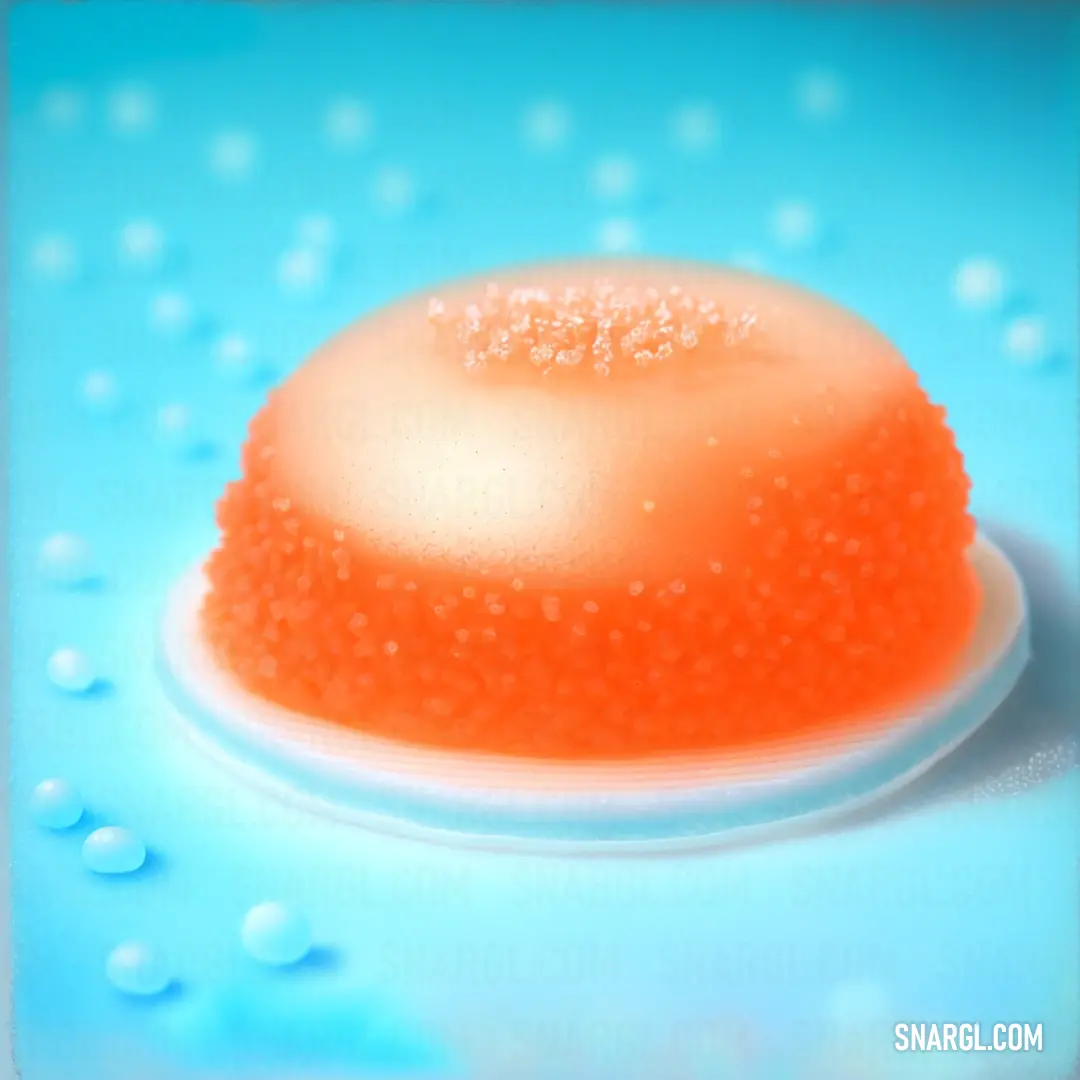 Close up of a cake on a plate on a table with water droplets on it and a blue background