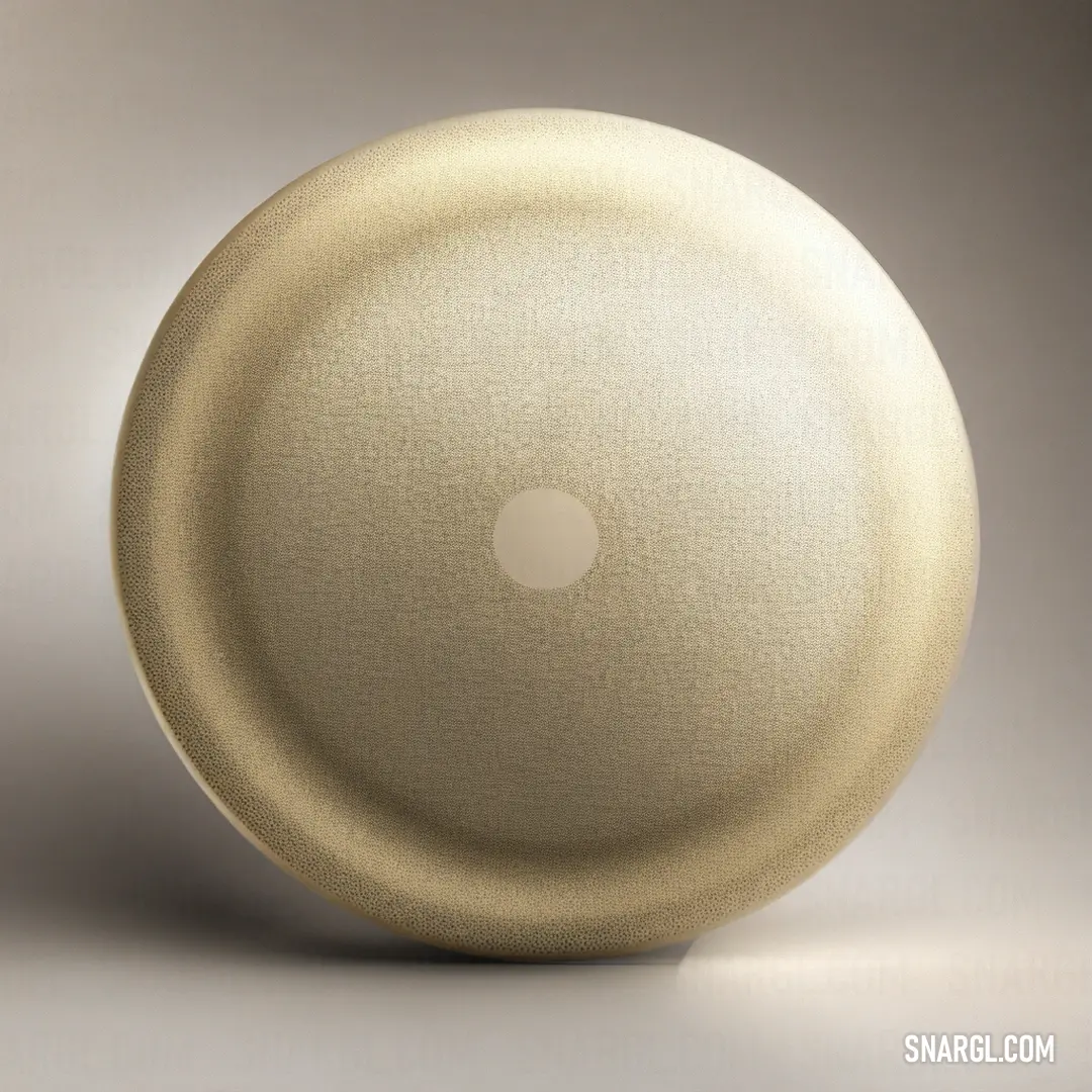 White object with a white circle on it's side and a white circle on the other side. Color Cosmic latte.