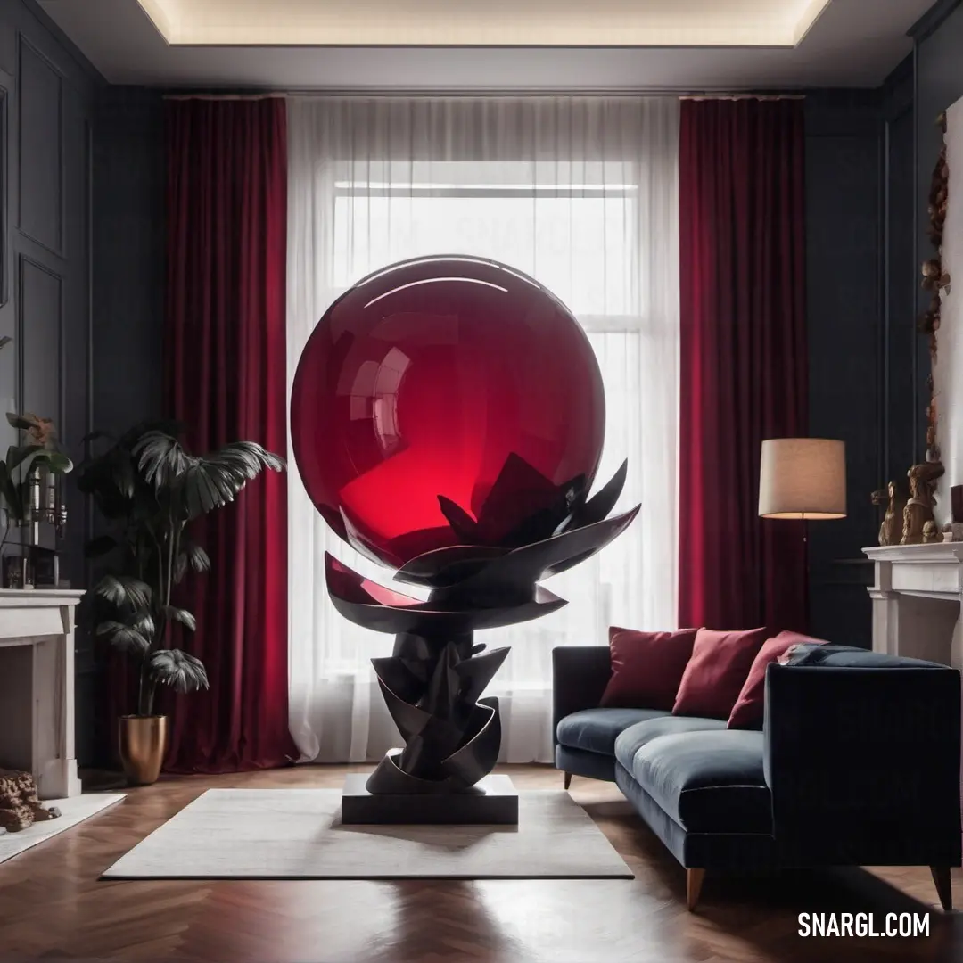 Living room with a couch and a large red ball in the center of the room. Color RGB 190,0,50.