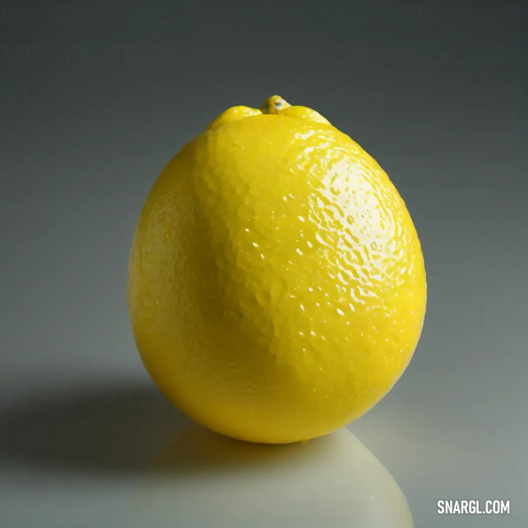 Yellow lemon on a table with a gray background. Example of #F0E130 color.