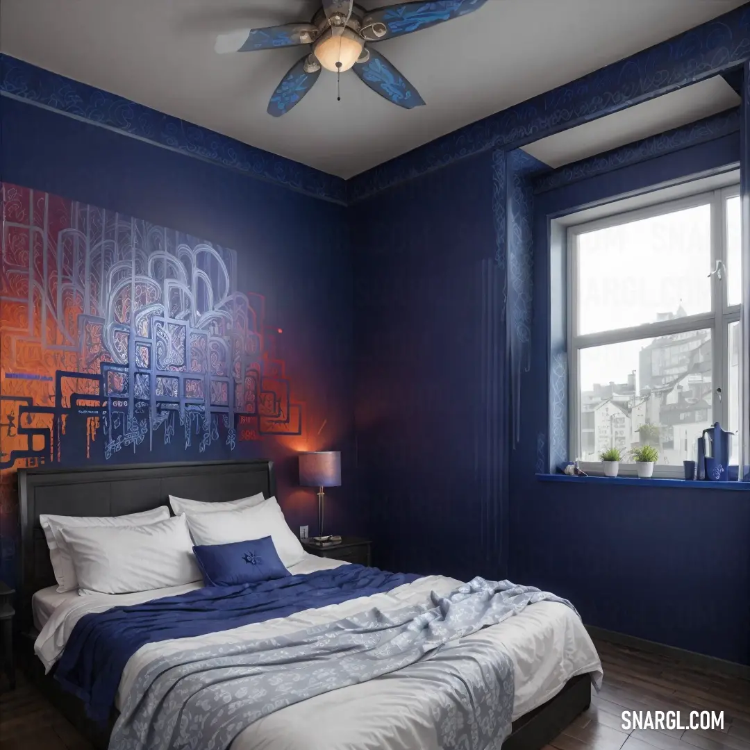 Bedroom with a blue wall and a large bed with a blue comforter
