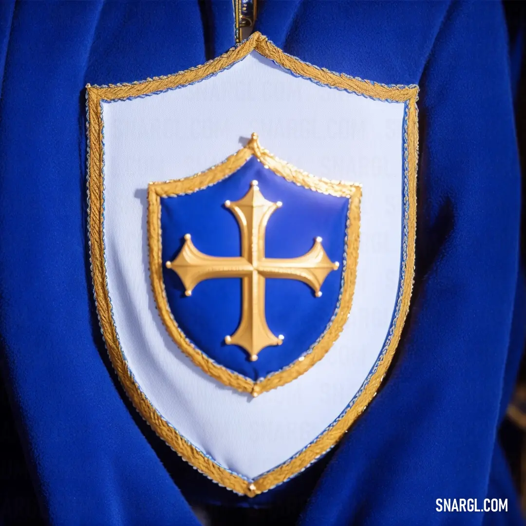 Blue and white coat with a gold cross on it's chest and a blue and white coat