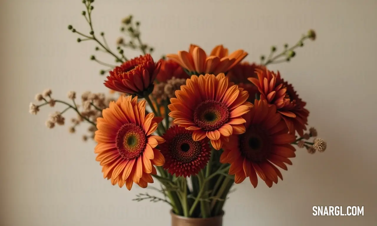 A vibrant vase brimming with cheerful orange flowers sits atop a table, complemented beautifully by a wall and window backdrop. Dark brown tones enrich the atmosphere, creating a lively yet cozy setting perfect for brightening any room.