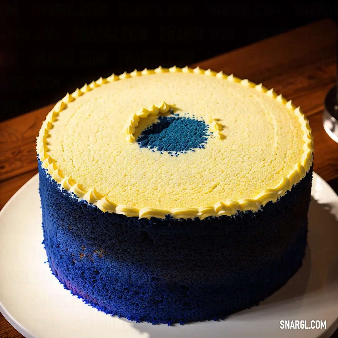Blue and yellow cake on a white plate on a table with a glass of wine in the background. Color #08457E.