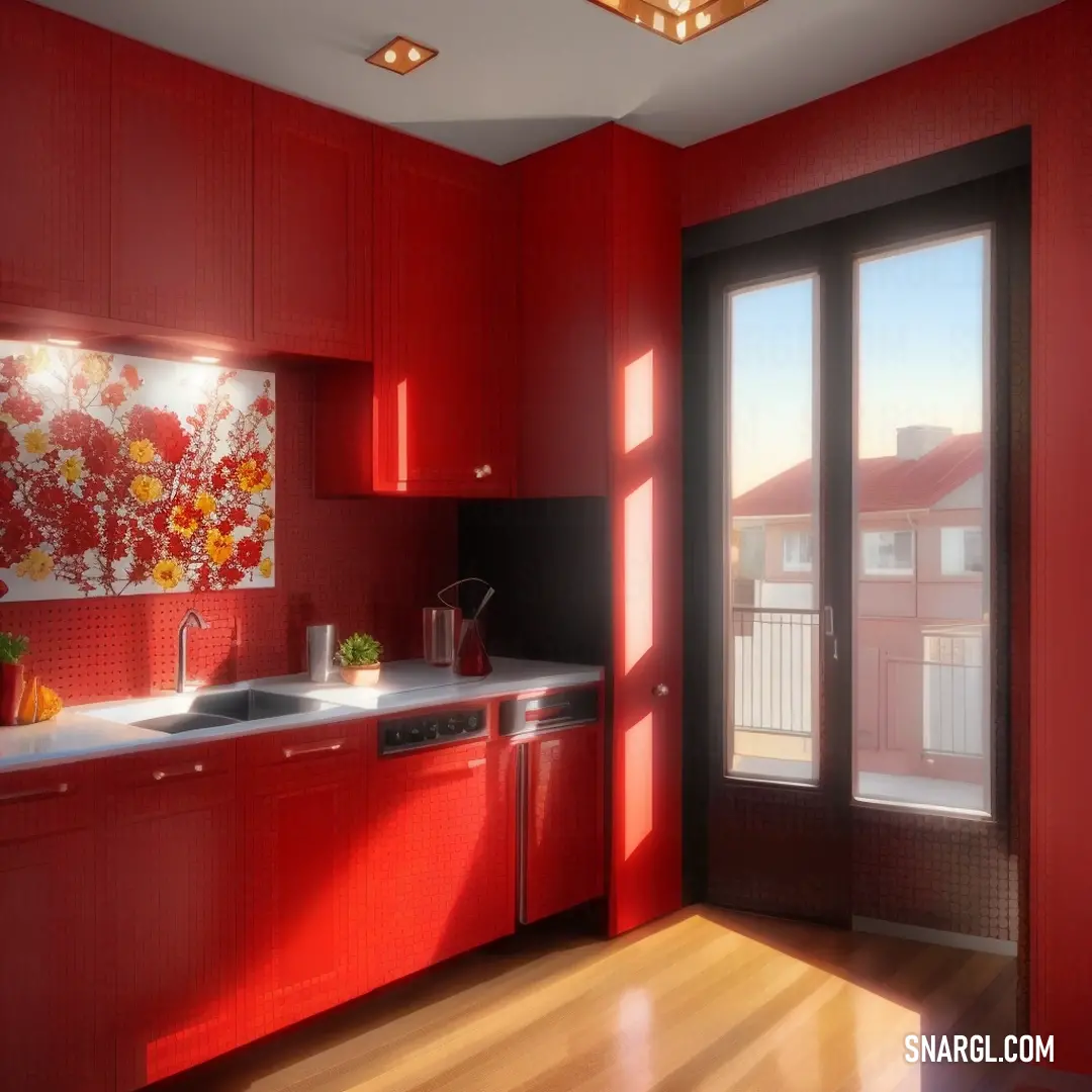 A vibrant kitchen, painted in dark coral, showcases a bold red wall with a painting above the sink. The large window frames a beautiful view of the outdoors, while the modern design of the room blends perfectly with the lively colors.