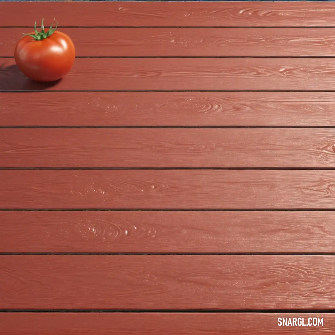 Tomato on top of a wooden table next to a knife and fork on a cutting board. Example of RGB 205,91,69 color.