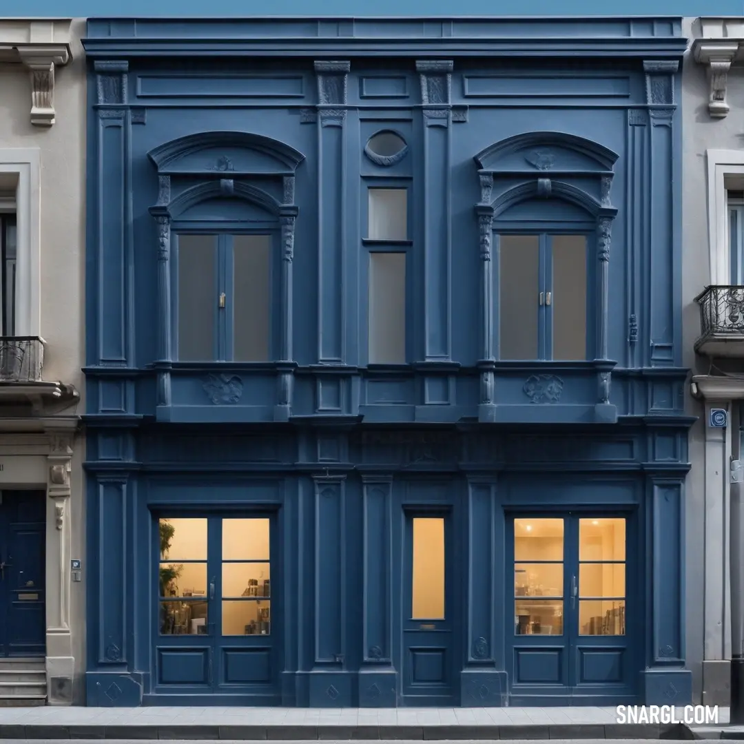 Blue building with a clock on the front of it's face. Example of #003366 color.