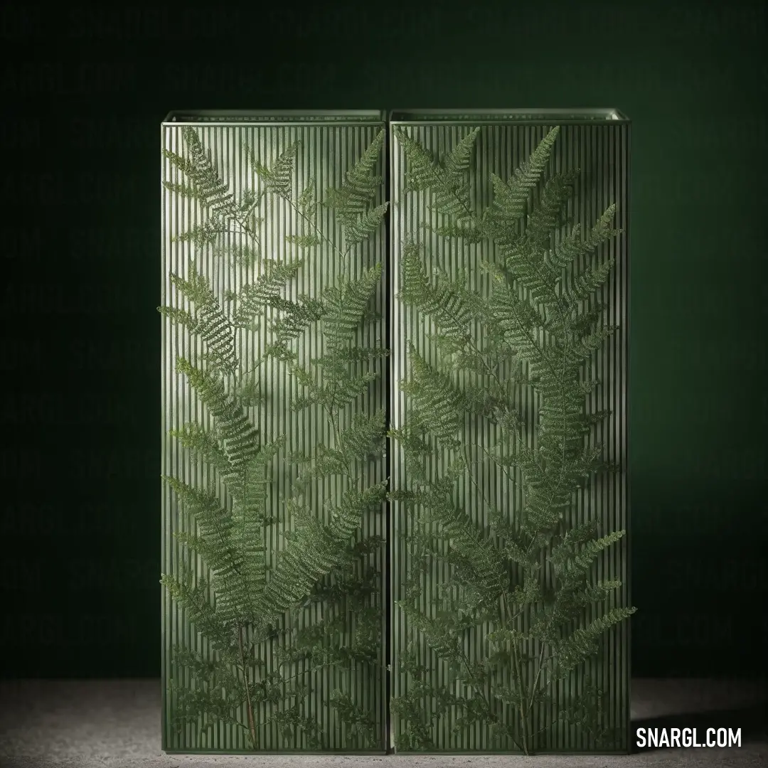Green cabinet with a leaf pattern on it's side and a dark background behind it. Example of CMYK 21,0,56,58 color.