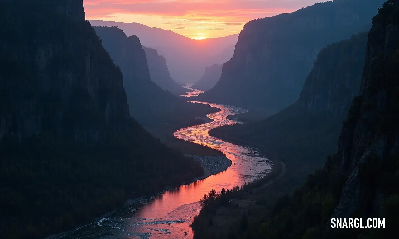 As the sun rises or sets, a river meanders gracefully through a valley enveloped by towering mountains, under a sky ablaze with striking shades of red, symbolizing nature's majesty.