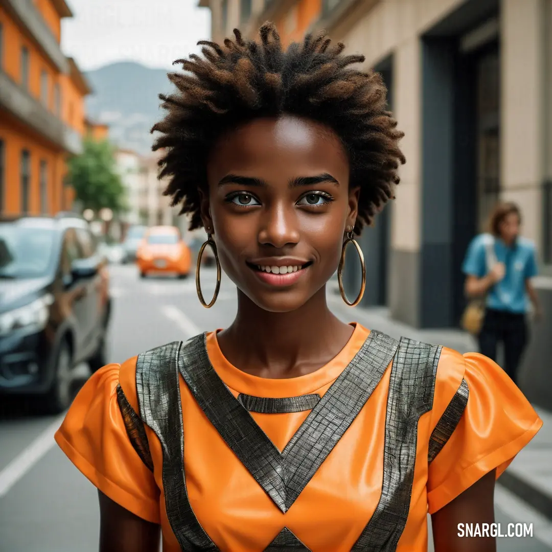 Woman with a pair of hoop earrings on her head standing on a street corner. Example of RGB 255,140,0 color.