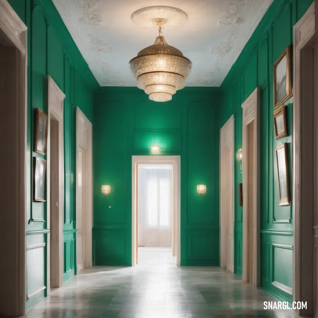 Hallway with green walls and a chandelier hanging from the ceiling and a door leading to another room. Example of Dartmouth green color.