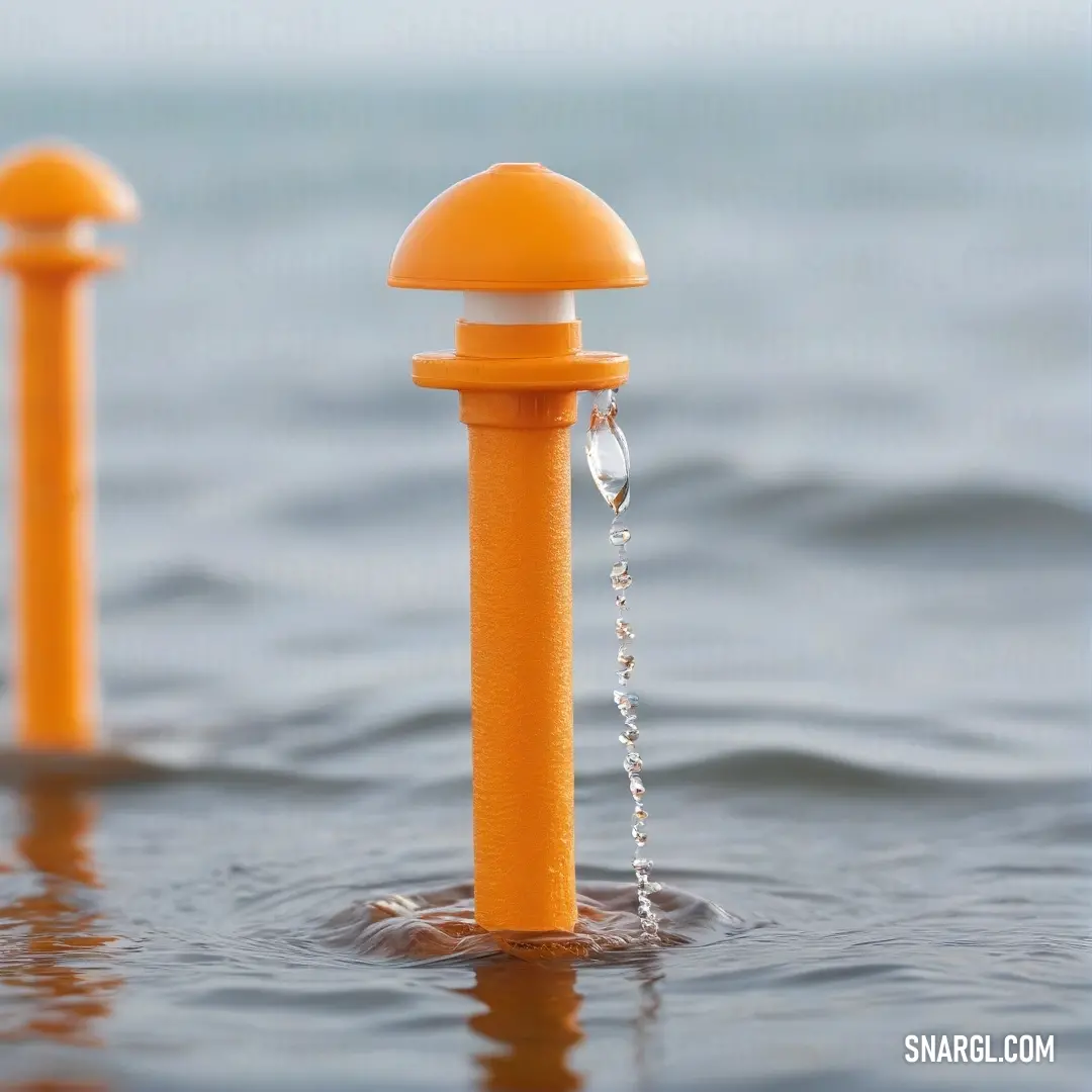 A vivid close-up of a shimmering water fountain capturing a single droplet poised to break free, surrounded by a rich, warm carrot orange hue that envelops the scene in tranquility.