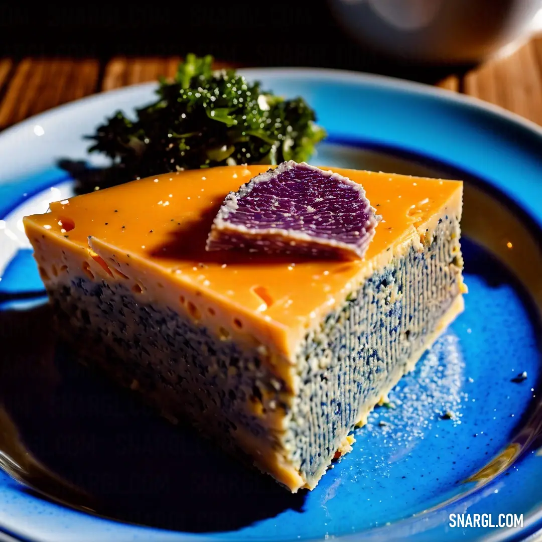 Piece of cake on a blue plate with a fork