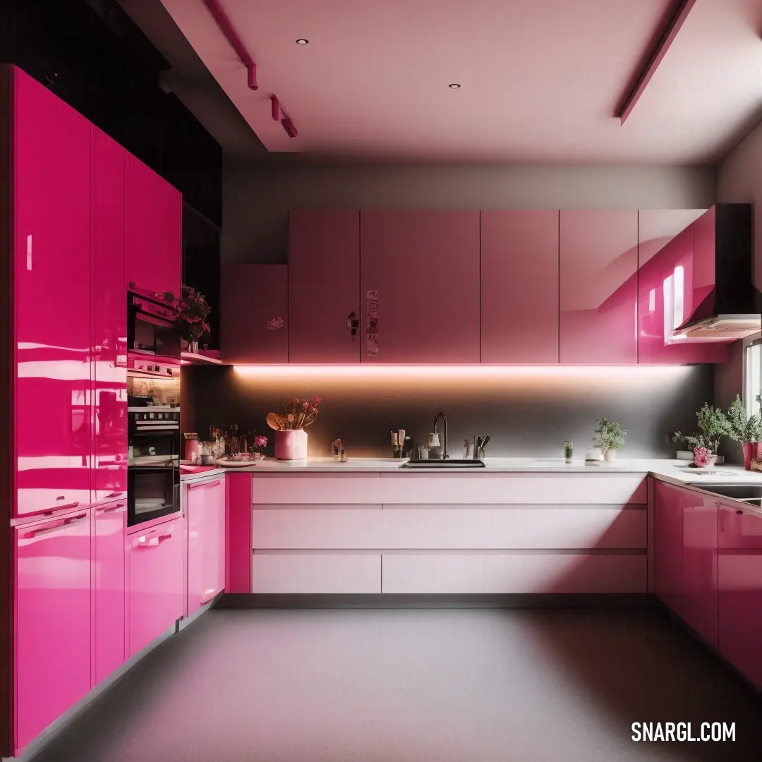 Kitchen with pink cabinets and a white counter top and a sink and oven in it and a potted plant