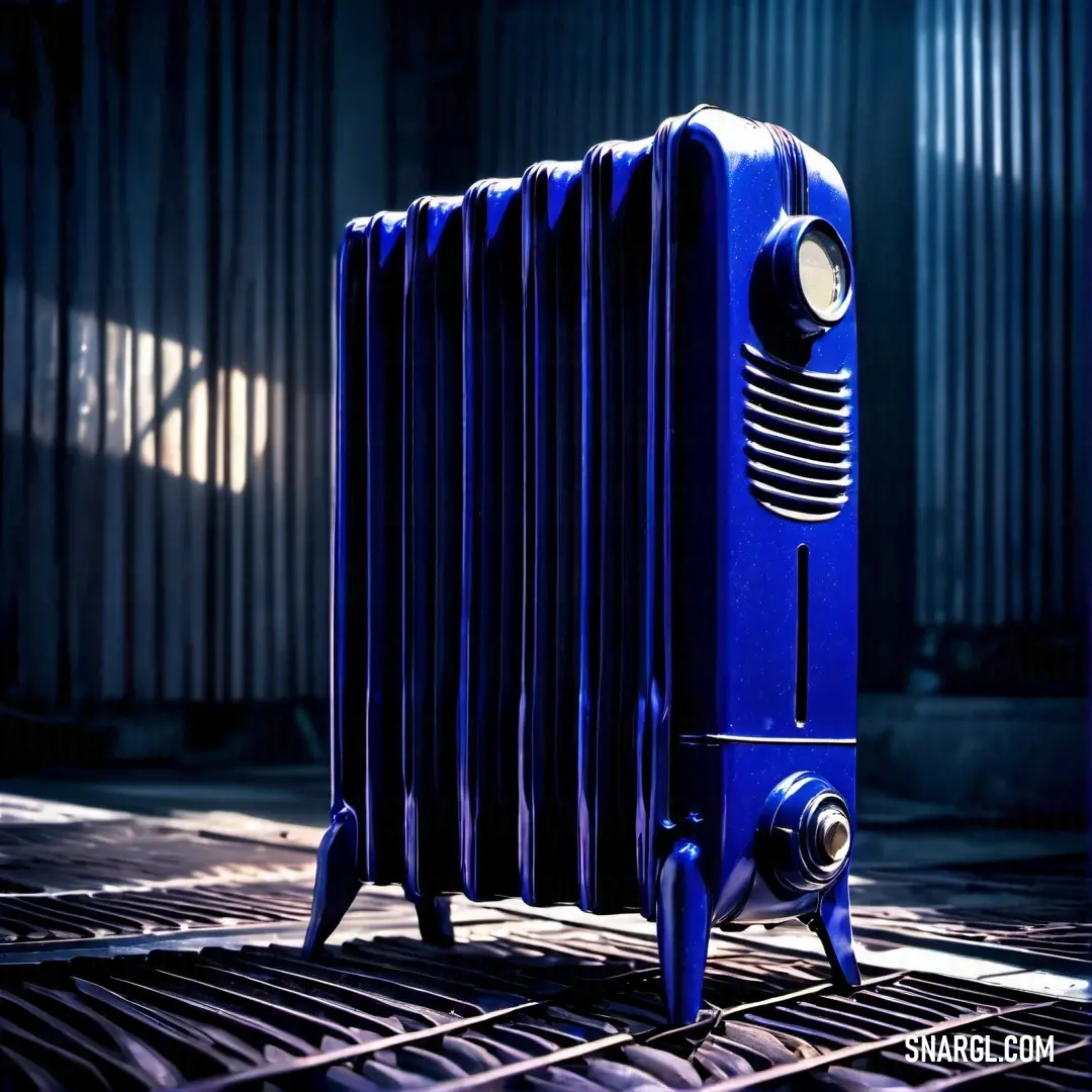 Blue radiator on a metal grate in a dark room with a light shining on it. Example of CMYK 100,100,0,39 color.