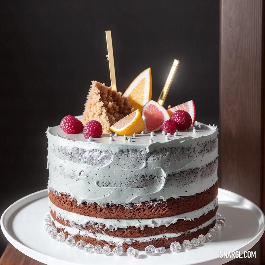 Cake with white frosting and fruit on top of it on a plate with a wooden door in the background. Color CMYK 0,34,16,62.
