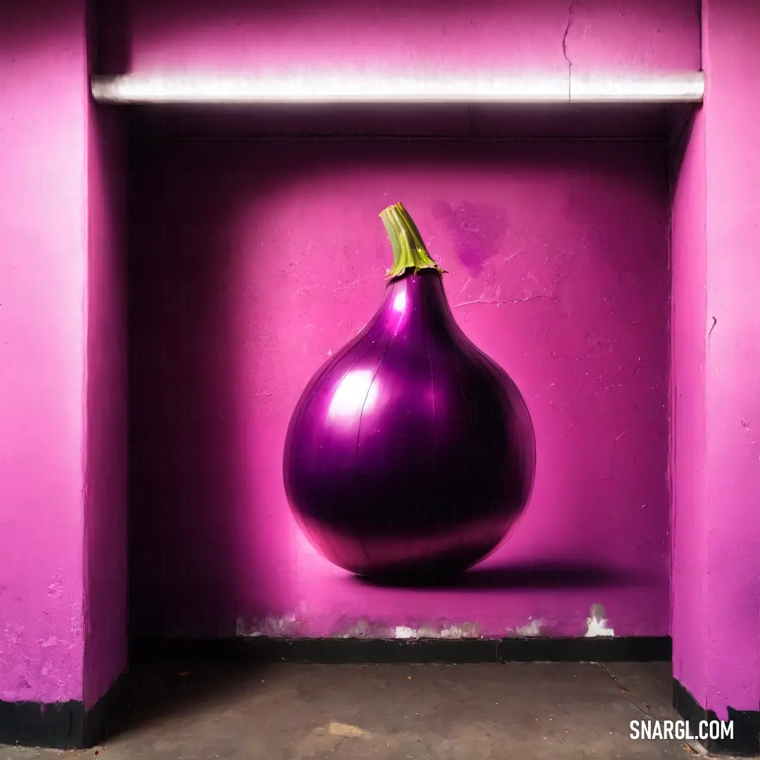 Purple vase in a purple room with a pink wall behind it and a yellow top on the top of the vase