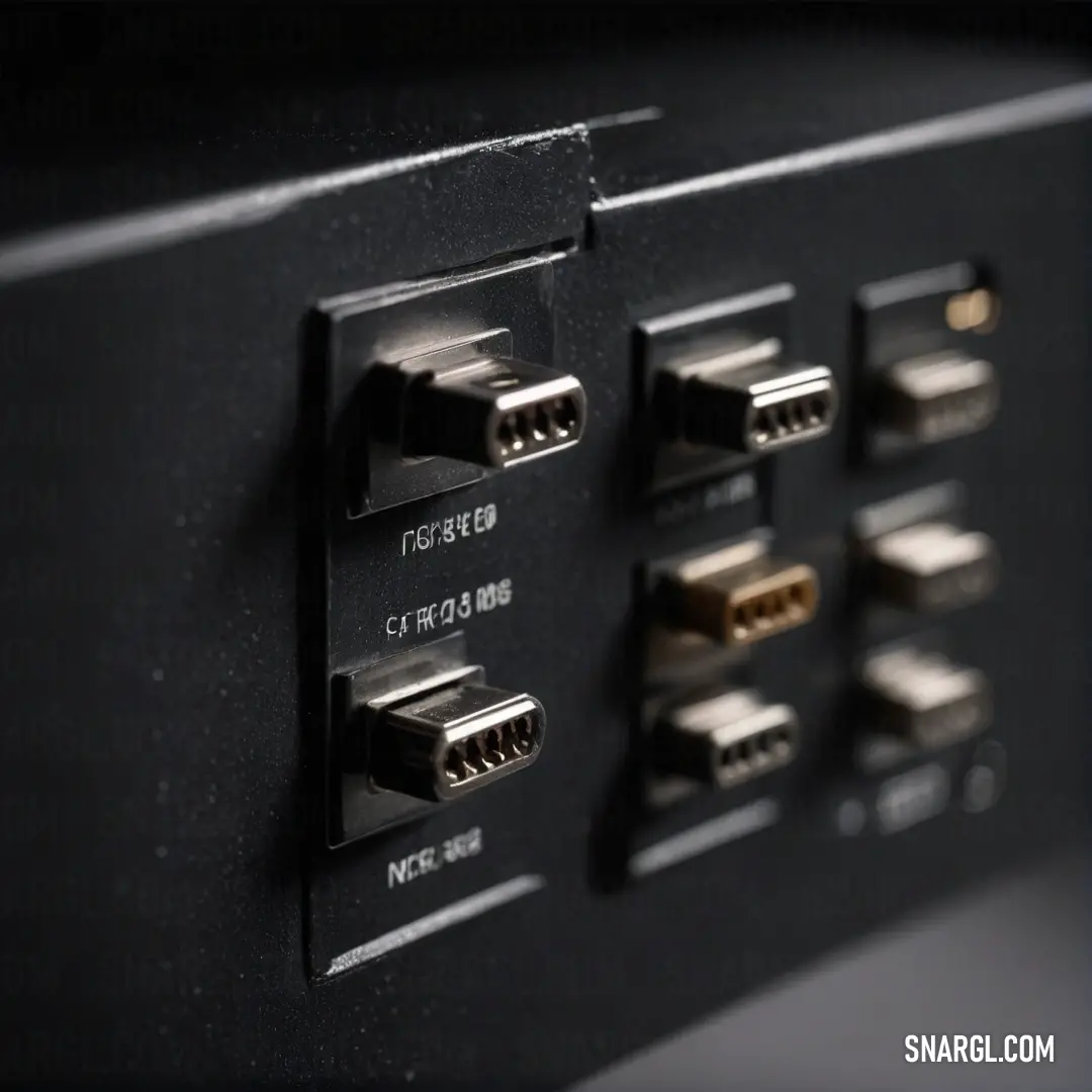 Artfully detailed close-up of a stylish black and gold device equipped with multiple ports, standing out against a subtle backdrop. The gentle color #F0EAD6 enhances the elegance of this technological piece.