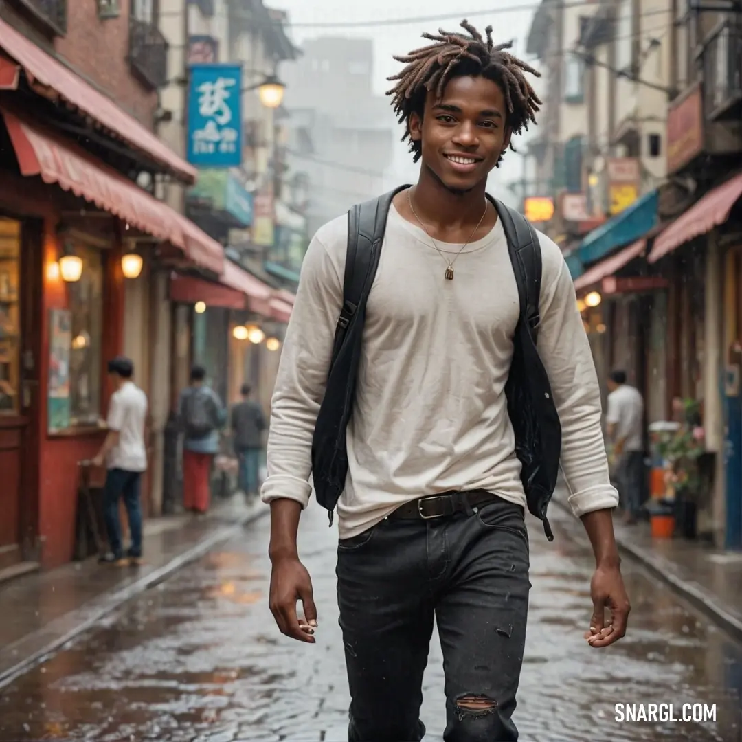 Eggshell color example: Man with dreadlocks walking down a street in the rain with a backpack on his back