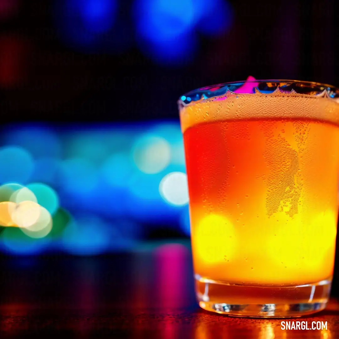 Glass of orange juice on a table with a blurry background