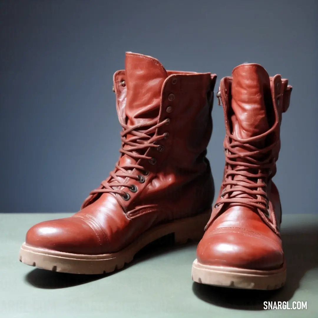 Pair of red boots on top of a table next to a wall and a window sill. Example of #801818 color.