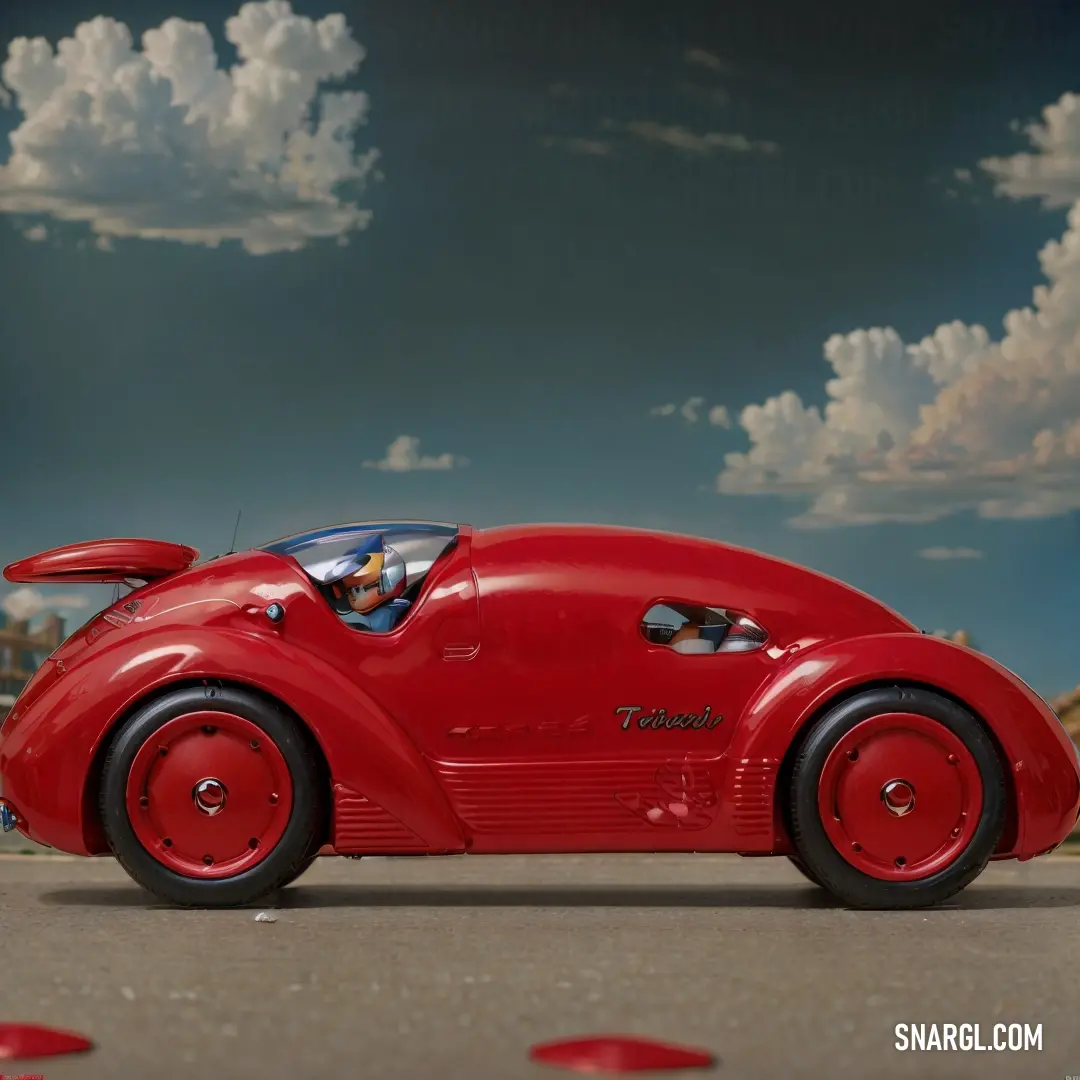 Red car is parked on the street with clouds in the background and a person in the driver's seat. Example of Falu red color.