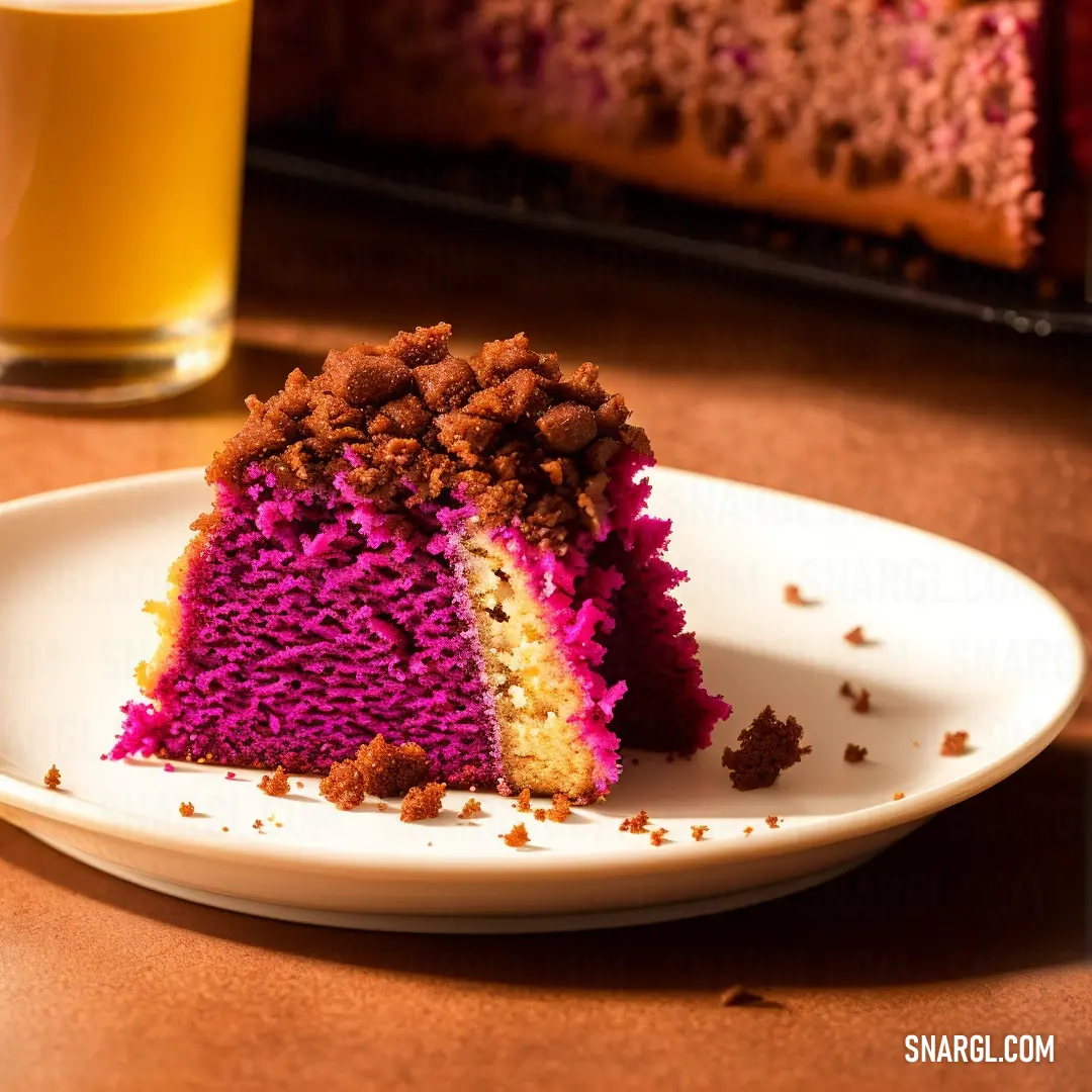 Piece of cake on a plate with a glass of beer in the background on a table