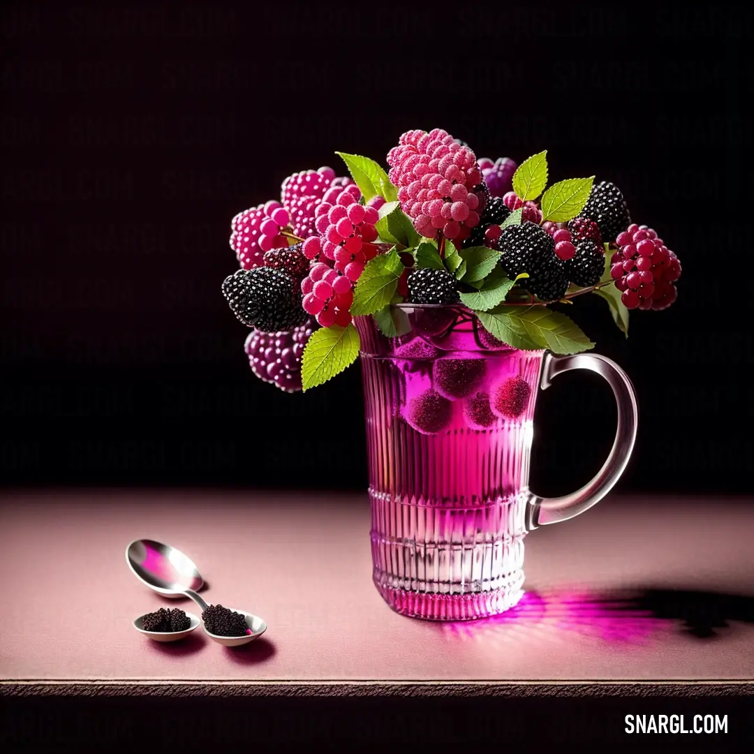 Pink vase with flowers and berries in it next to a spoon and a spoon rest on a table