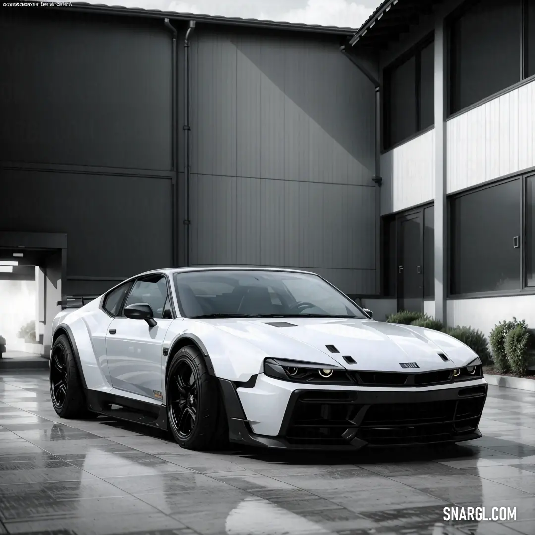 White sports car parked in front of a building with a sky background and a black and white photo