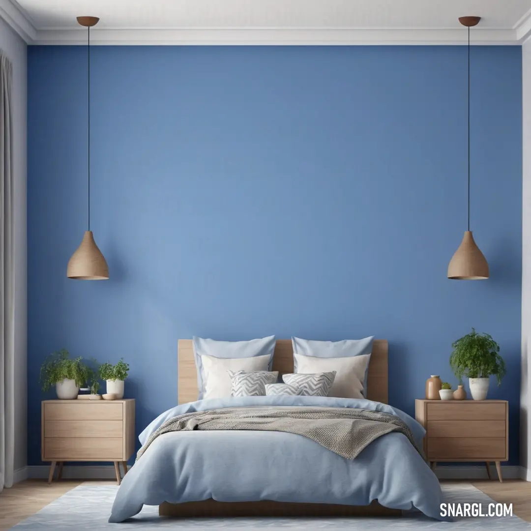 Bedroom with blue walls and a bed with a blue comforter and pillows and two planters on the nightstands. Example of #6082B6 color.