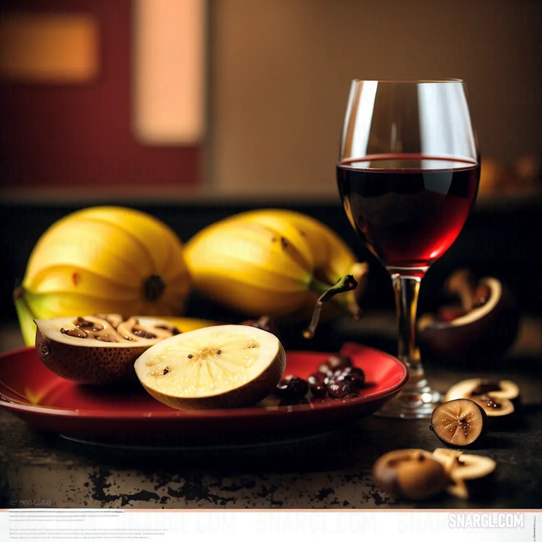 Glass of wine and some fruit on a plate on a table with other fruit and nuts on it. Example of Gold color.
