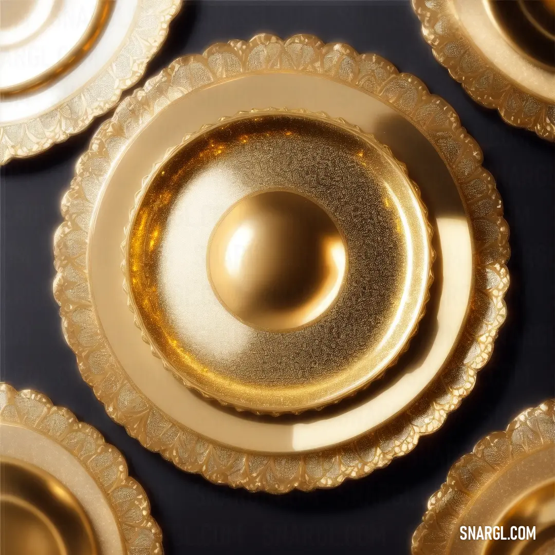 Group of gold plates with a shiny center piece on top of them