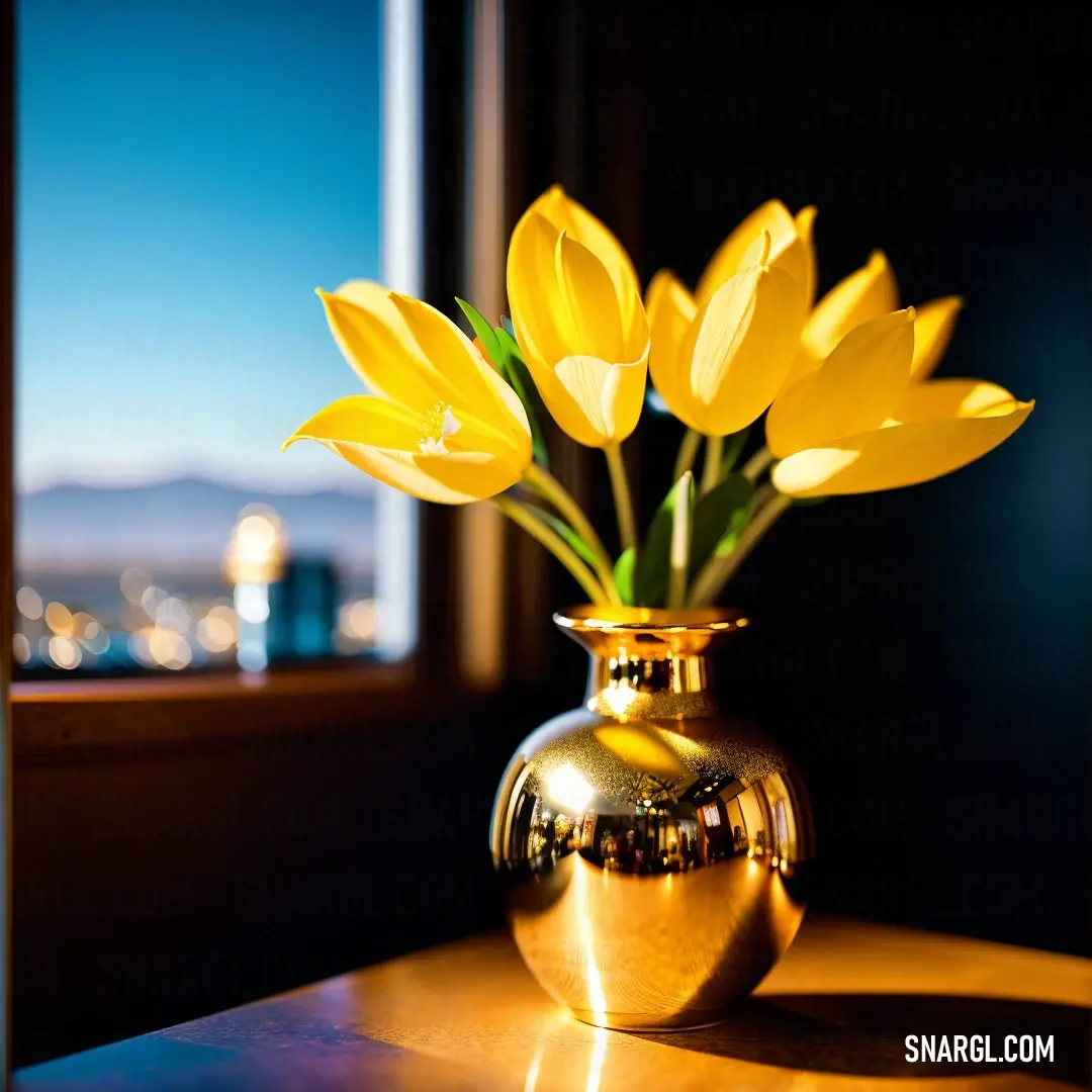 Vase with yellow flowers on a table in front of a window with a view of the city below. Color RGB 255,215,0.