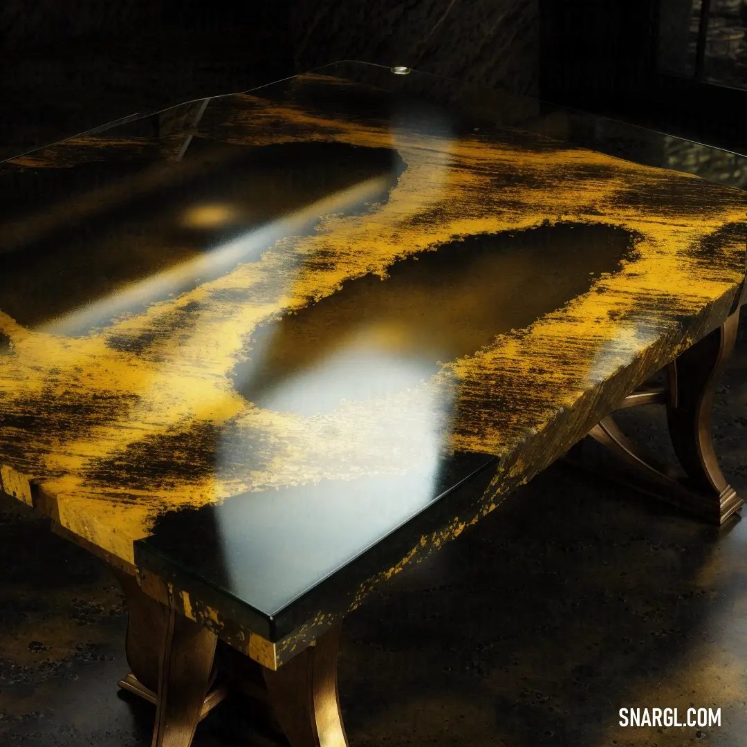 Table with a yellow and black design on it's surface and a black and gold base and a black and white design on the top