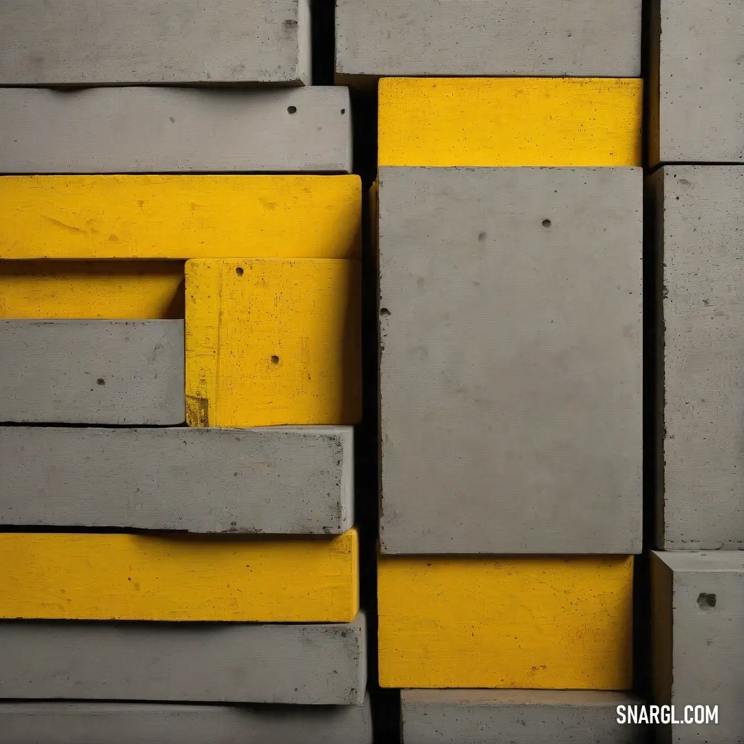 Goldenrod color example: Yellow and gray wall with a bunch of blocks of concrete on it's sides and a yellow stripe on the bottom
