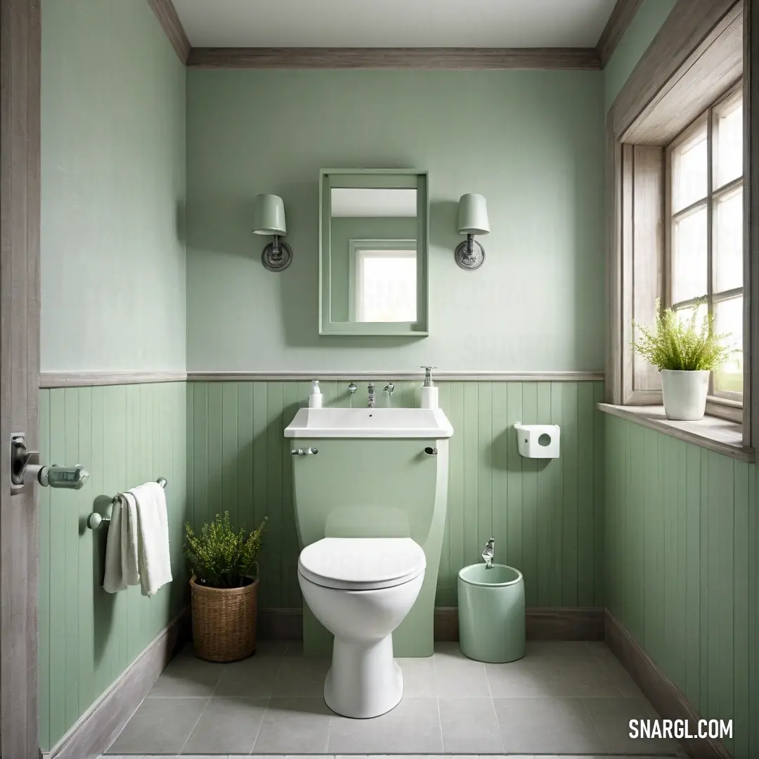 Bathroom with a toilet, sink. Example of RGB 168,228,160 color.