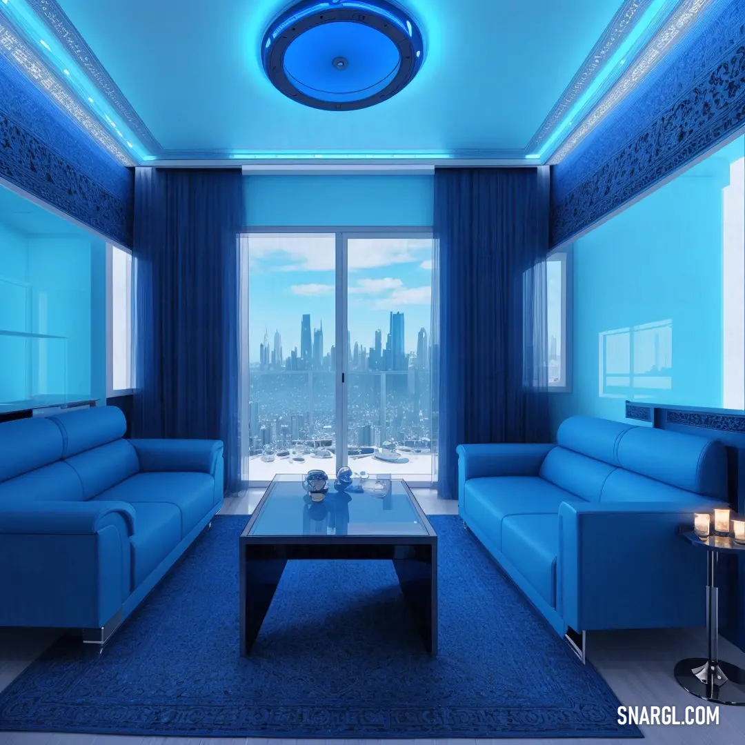 Living room with blue furniture and a large window overlooking a city skyline at night time