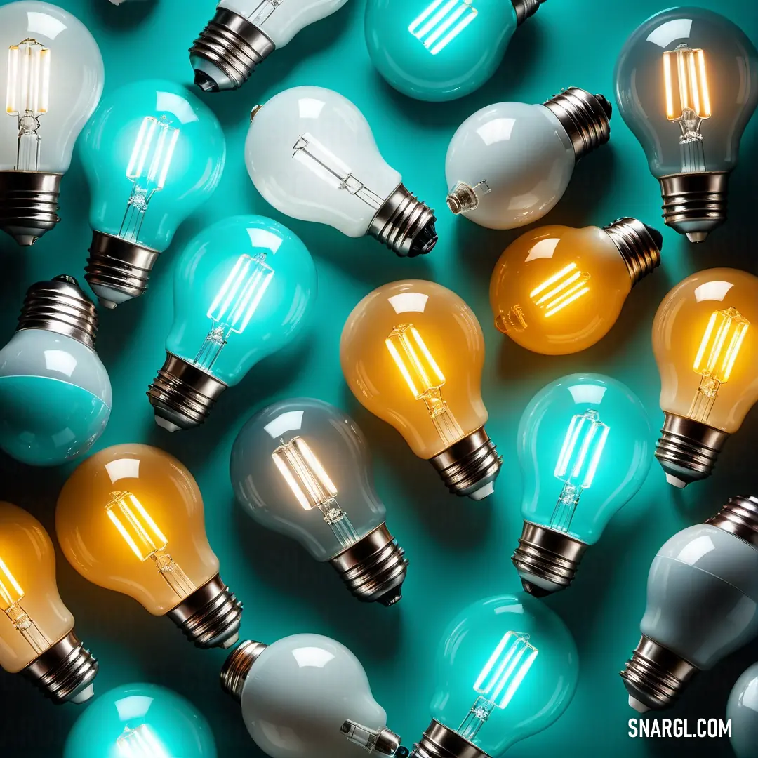 Group of light bulbs next to each other on a table with a blue background. Example of RGB 218,145,0 color.