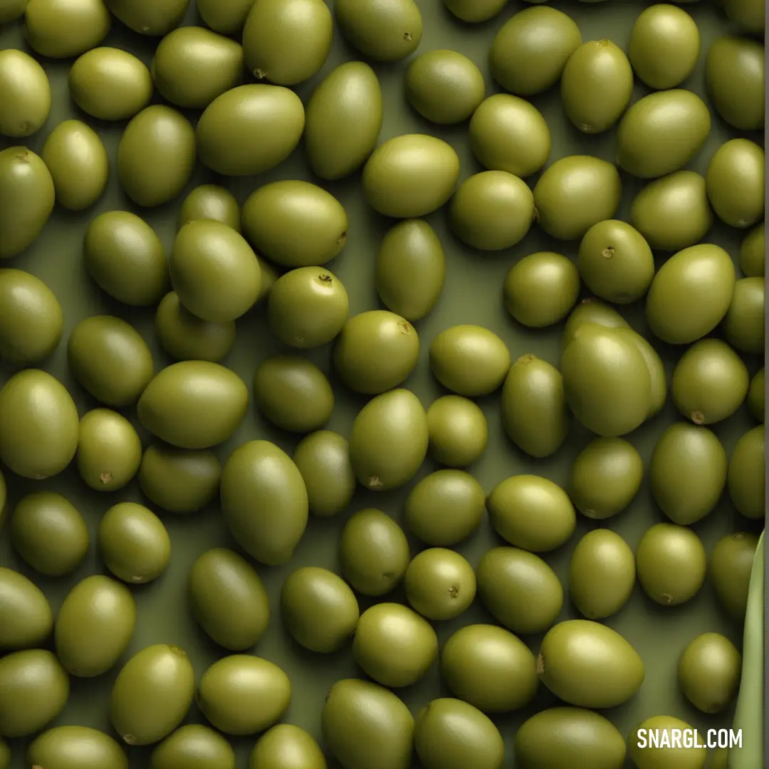 Bunch of green olives are in a bowl together. Example of RGB 128,128,0 color.