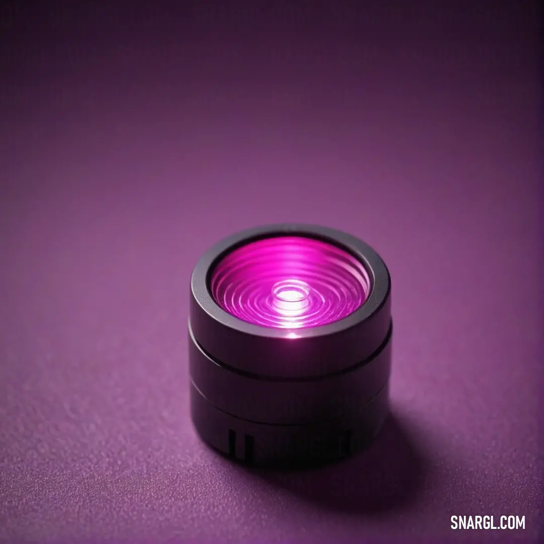 Radiating a soft purple glow, this light shines on a textured purple surface, enhancing its depth and beauty, beautifully represented with the CMYK values of 6,0,6,0.